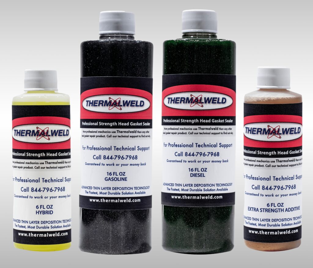 A group of four bottles of paint.